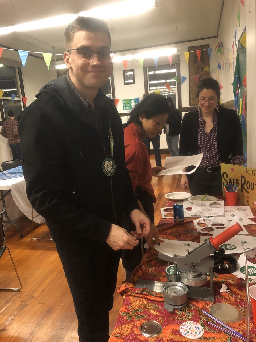 Nick demonstrating how to use the button-maker