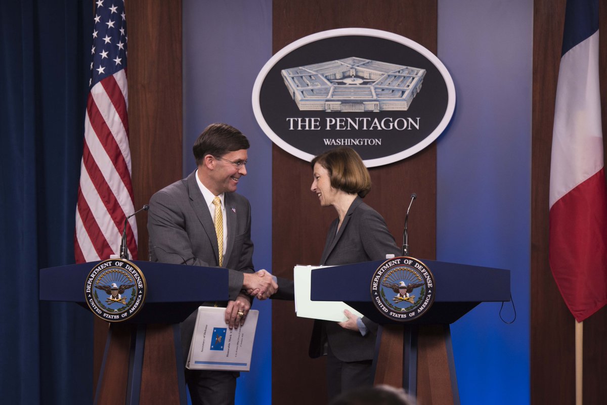 Secretary Esper and the French Defense Minister shake hands at a Pentagon press conference.