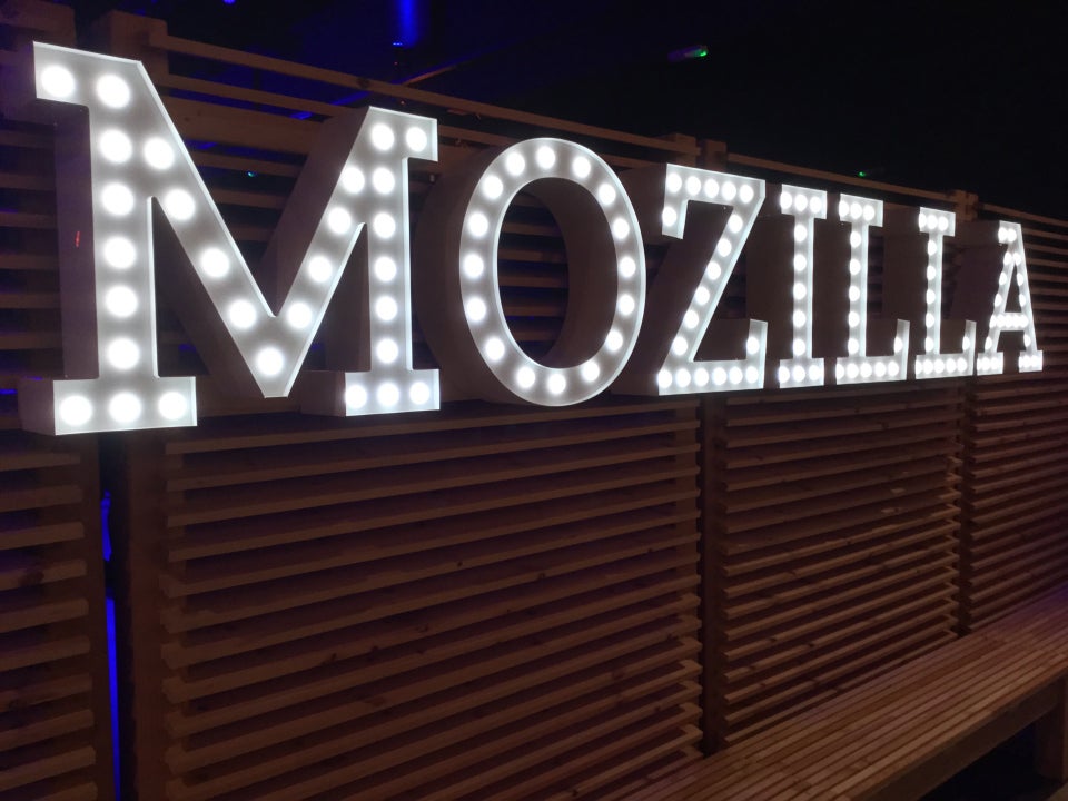 MOZILLA sign in bright lightbulbs on a wall.