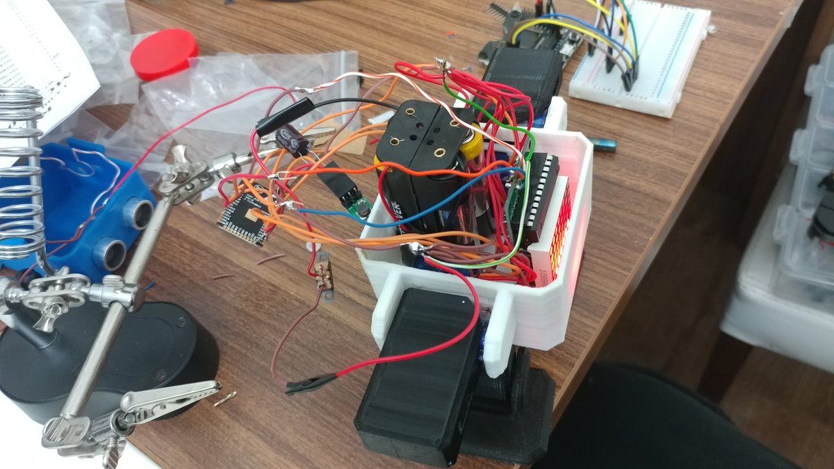 gazialankus's tweet photo. Otto ESP32 progress from last night. Now I know how to solder those tiny castellated side holes of the bare ESP32. Also I'm much more comfortable using the soldering iron to make little mods on 3D prints. Was able to cram all that in Otto, must plan better tho. #actuallyworks https://t.co/WIi9Q6sFtC