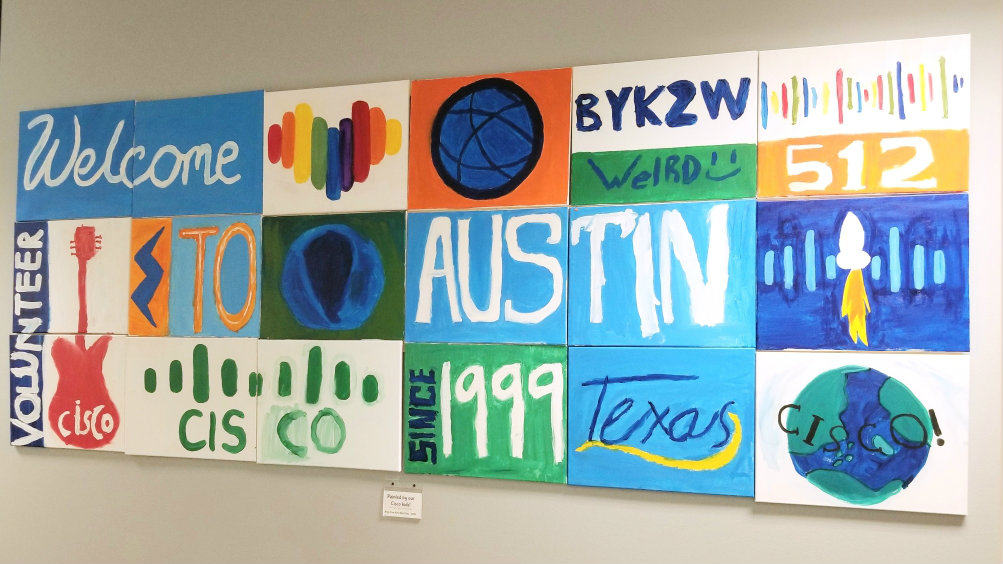 A colorful wall of paint arts that compiled the words "Welcome to Cisco Austin, Texas"