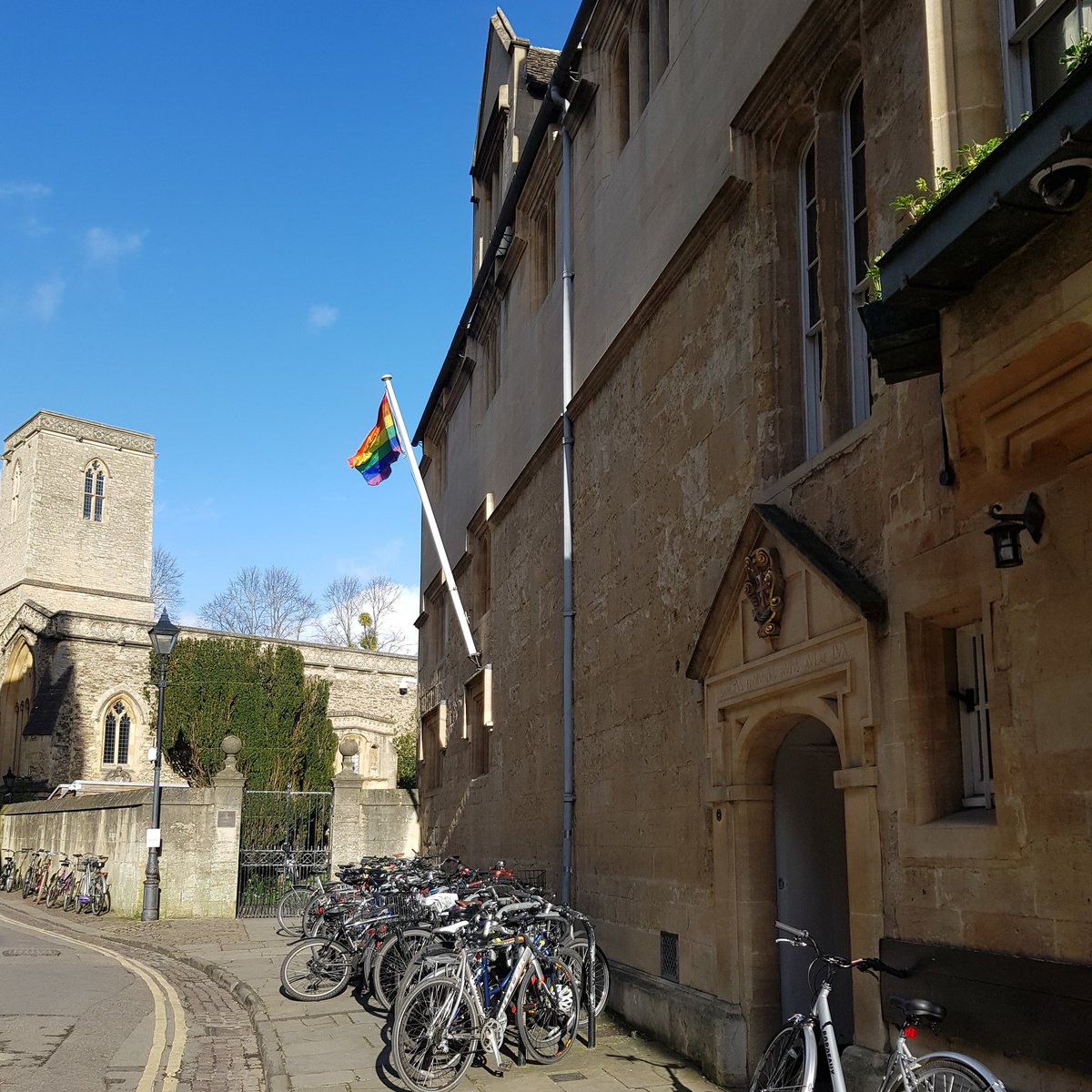 Lgbtq flag flying outside of Teddy Hall