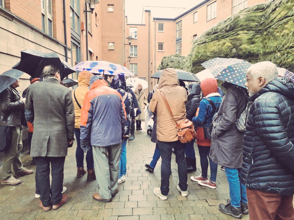 people walking with umbrellas