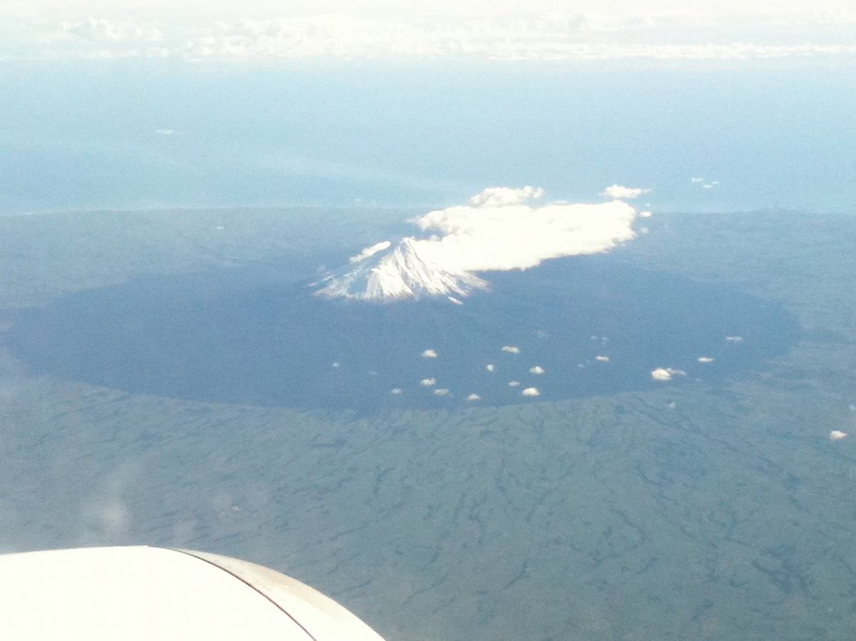 View of Taranaki from a commercial flight. The area protected from agriculture is a perfect circle.