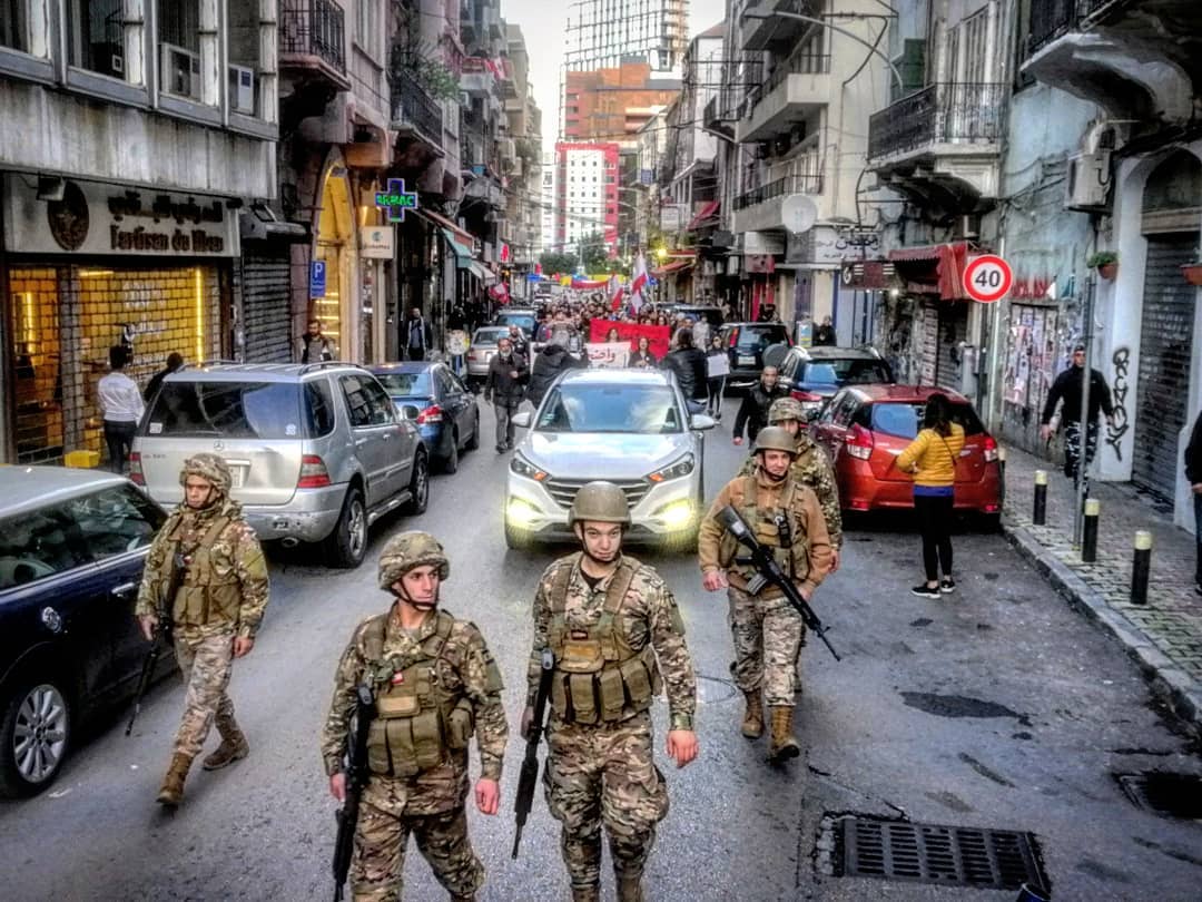CarmenGeha's tweet photo. Security forces walk ahead of peaceful protests today in #Beirut and in the North, day 109 of the revolution @ProtestsLebanon https://t.co/utNlqFQKnb