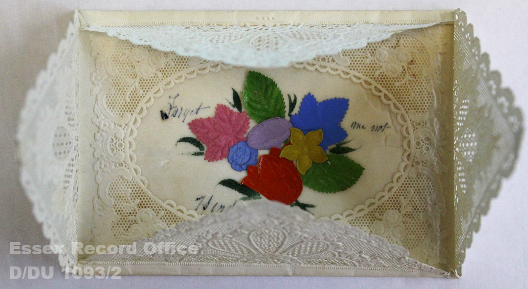 Lace panels partially opened to reveal colourful flower design. Green, red, pink, yellow, blue, purple, red