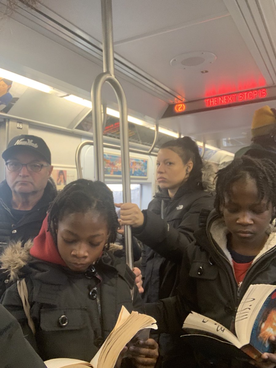 DevriVelazquez's tweet photo. stood by these beauties on the train and felt so empowered/hopeful. my applause goes to any parent figures instilling greatness in our future generations. 📖👏🏽 https://t.co/K6yGMlRKzi
