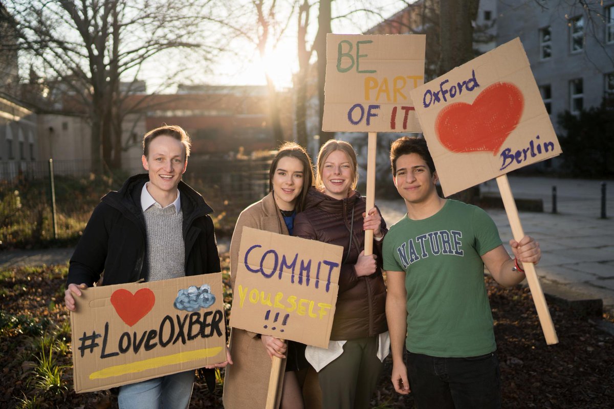 Students posing with Love Oxford Berlin posters.