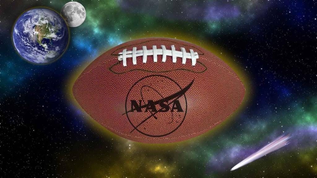 A football emblazened with the NASA logo floats in space with Earth, the Moon and a comet in the background