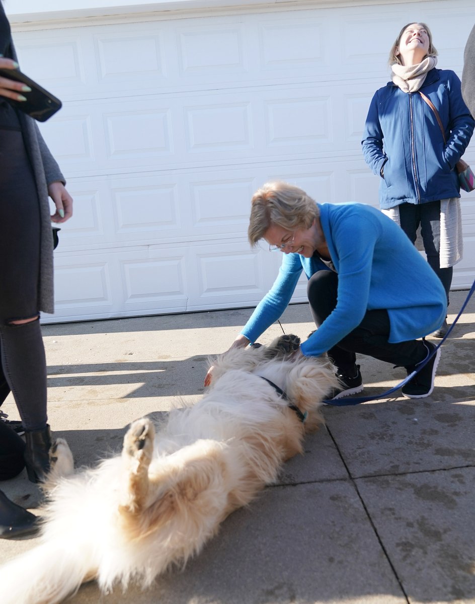 Elizabeth Warren pets her dog, Bailey.