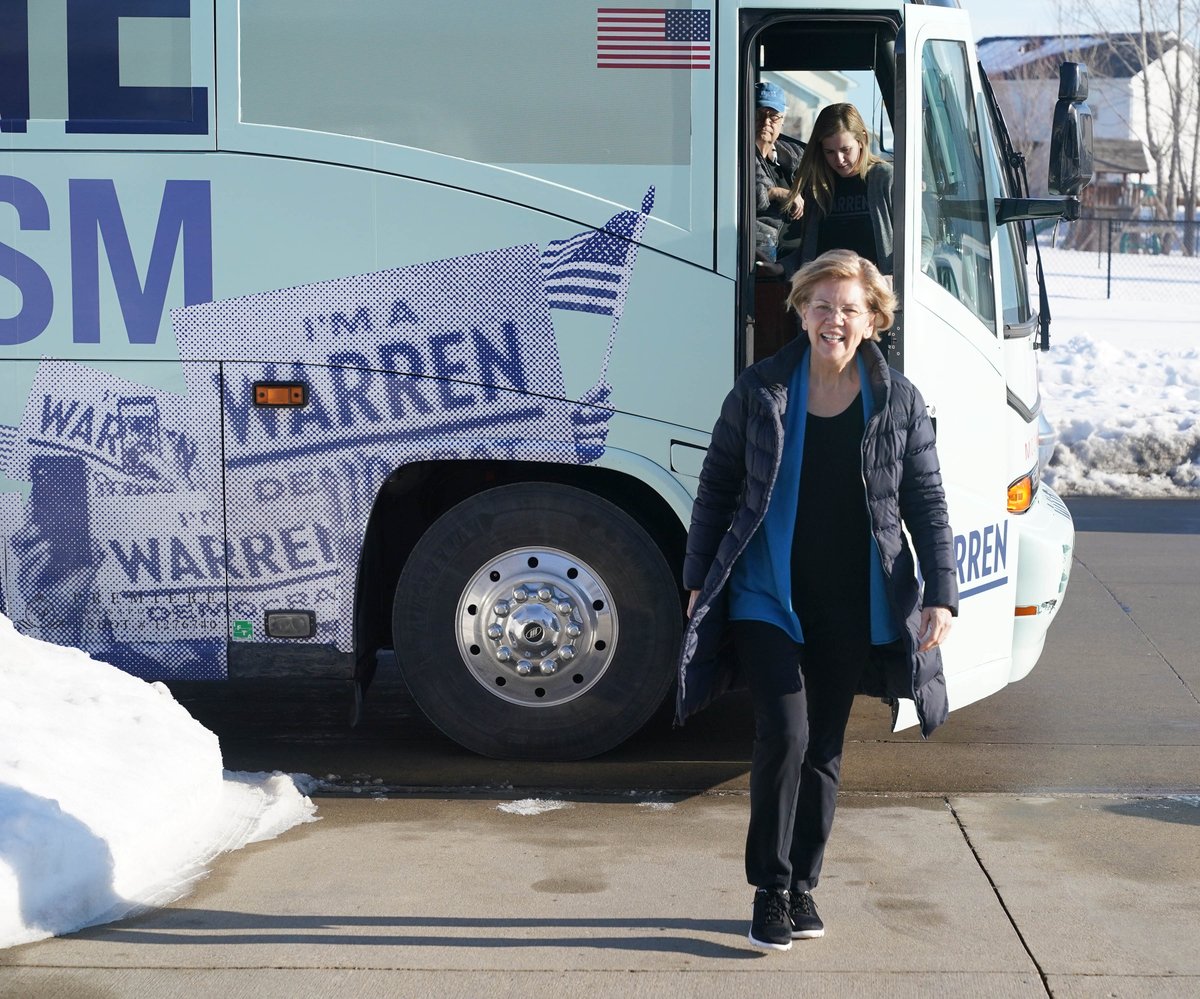 Elizabeth Warren steps off the campaign bus.