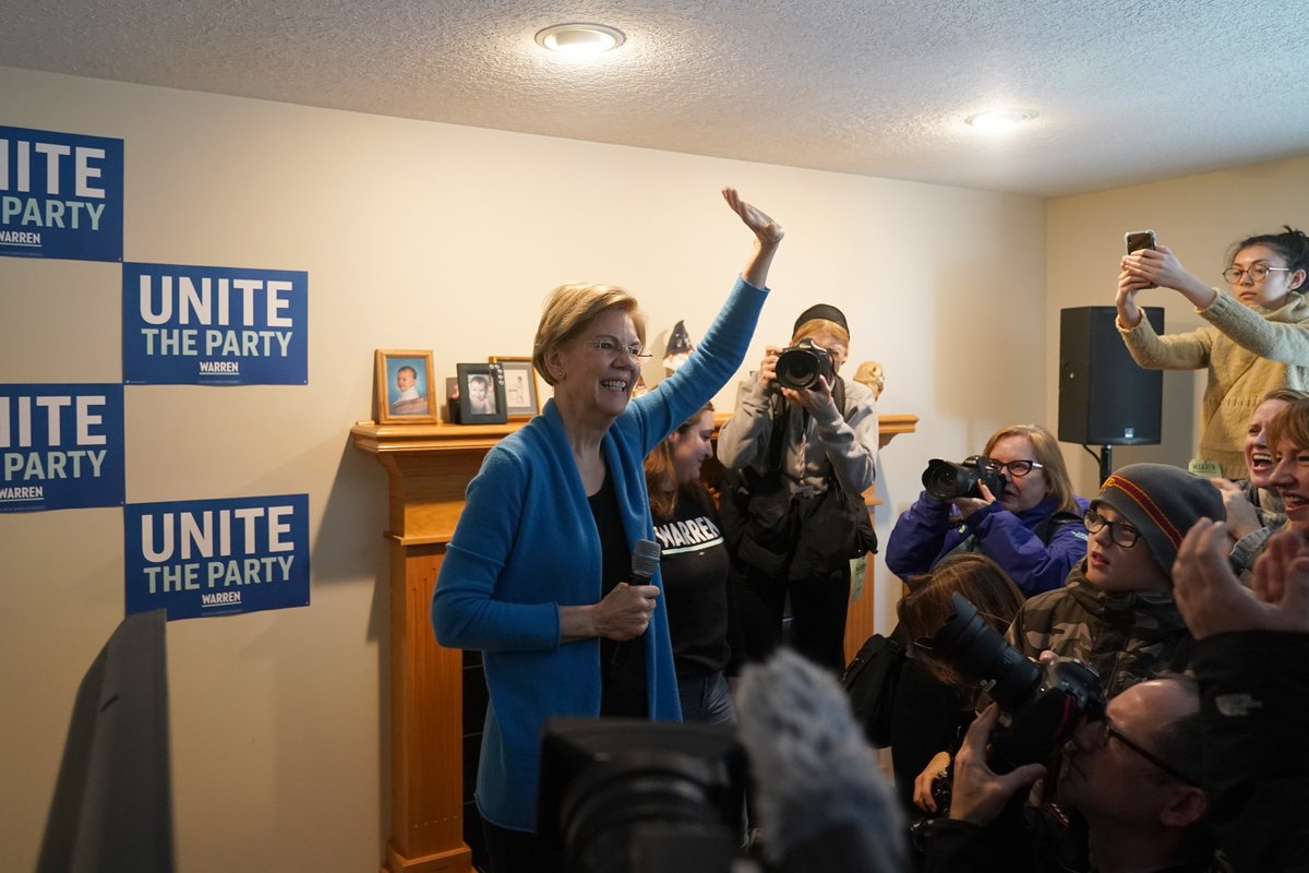 Elizabeth Warren greets a group of volunteers.
