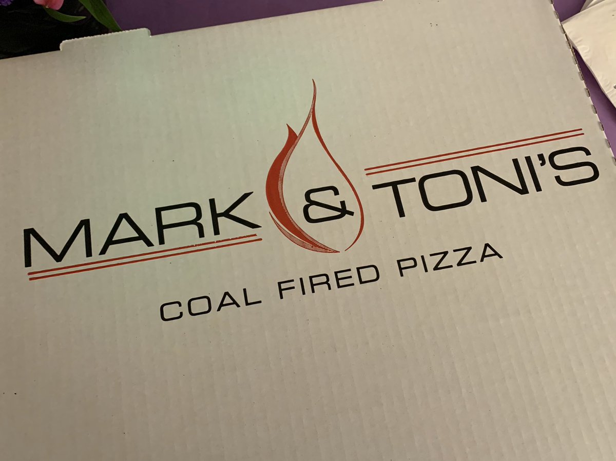 Pizza box labeled “Mark & Toni’s coal fired pizza”