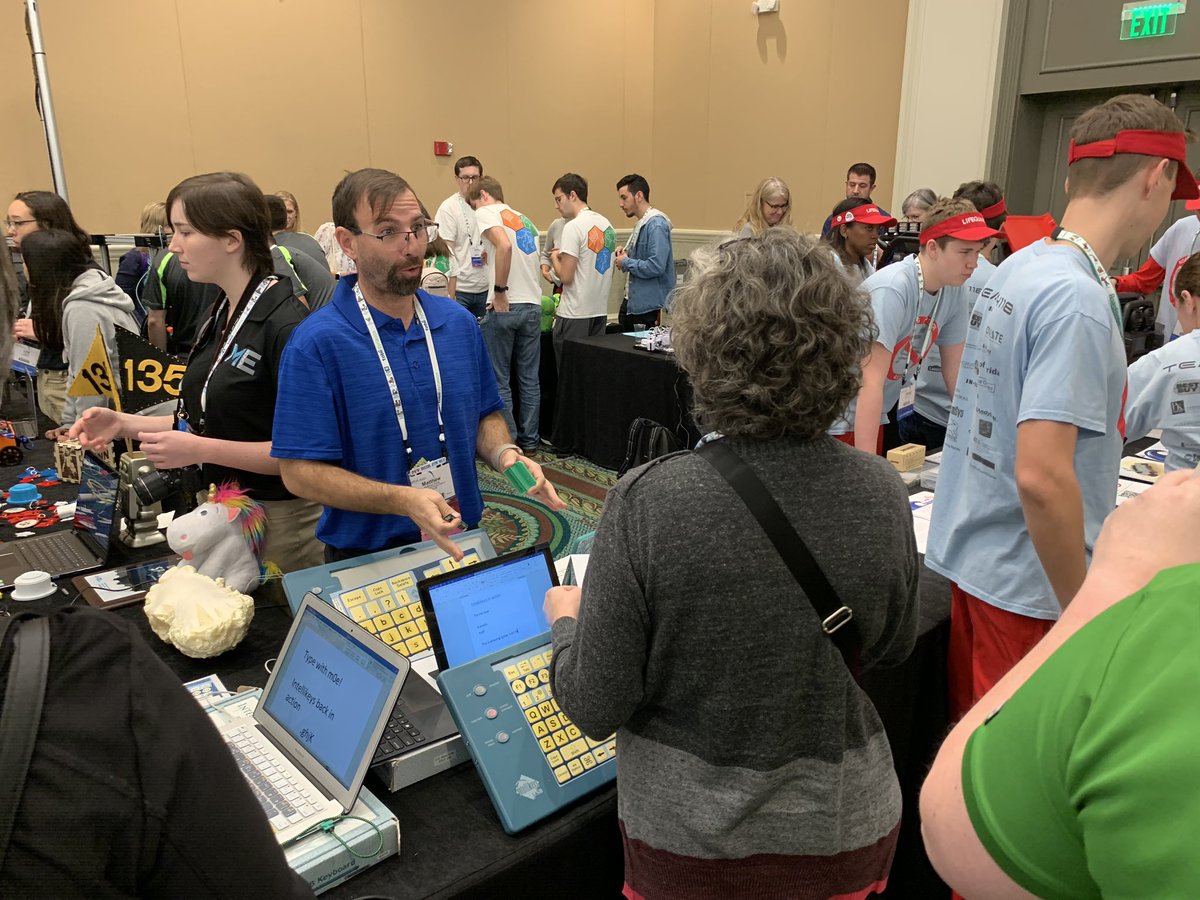 Matthew at AT Makers event surrounded by people