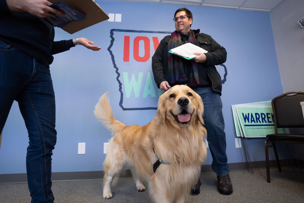 Elizabeth's son, Alex, with Elizabeth's dog, Bailey, in a campaign office in Iowa.