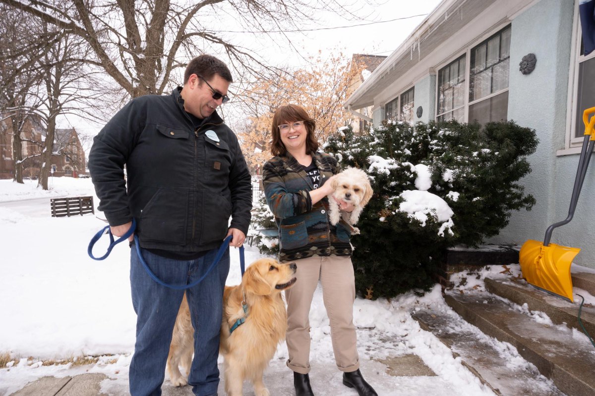 Elizabeth's son, Alex, with Elizabeth's dog, Bailey, as well as a supporter and another dog.