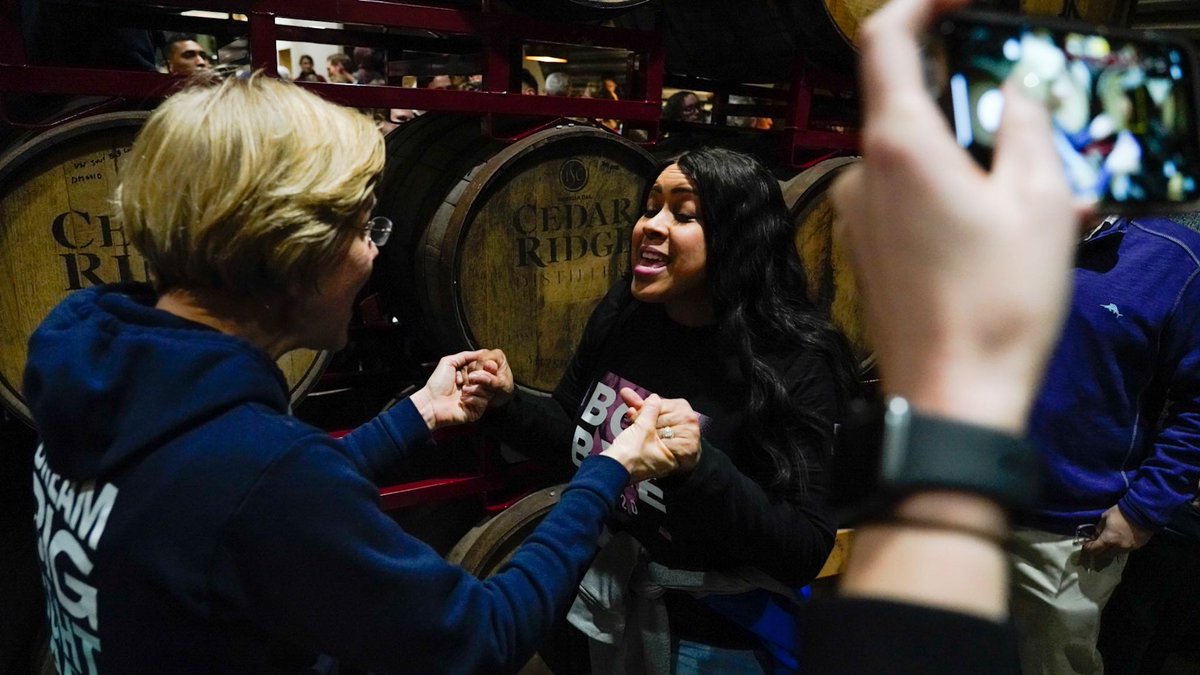 Elizabeth Warren talks to a supporter.
