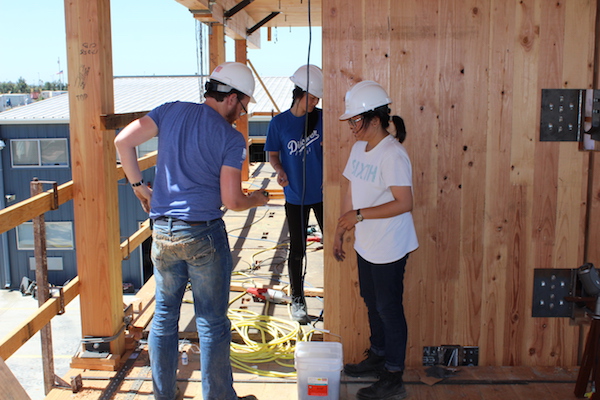 REU students working on the world's largest outdoor shake table, at UC San Diego.
