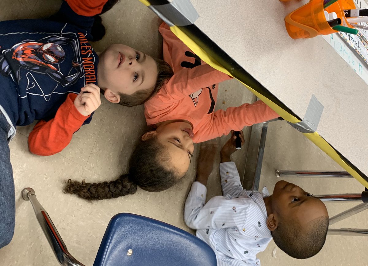 LeGRANDprek's tweet photo. We practiced name writing under the table! Laying under the table gives the children the proper wrist and arm posture without them realizing it. Who says learning can’t be silly and fun? #learningthroughplay #weareprek #intentionalinstruction https://t.co/n5xmuTuiHC