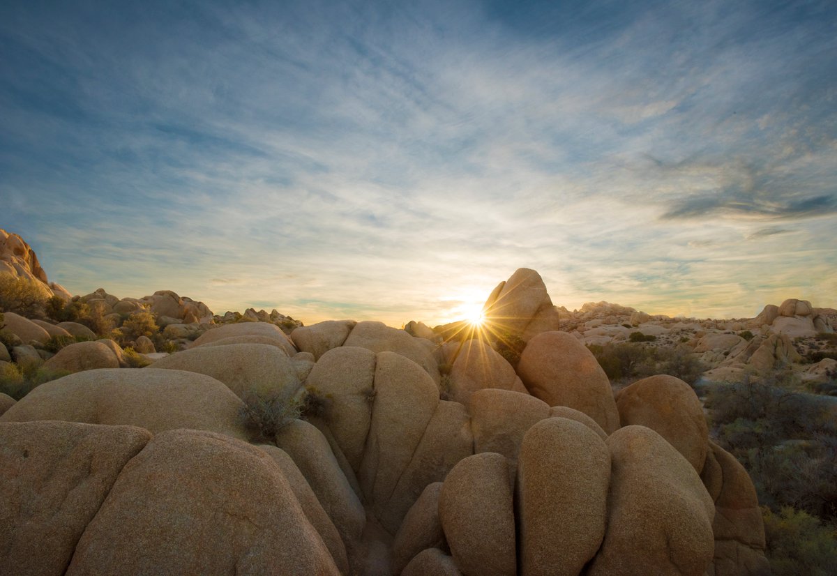 Photo: NPS / Hannah Schwalbe

The sun sets over dozens of granite boulder formations.