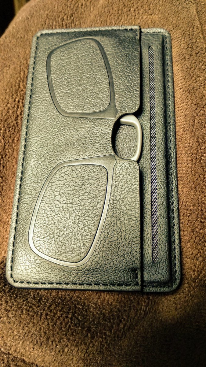 Reading glasses that stick to the back of your phone. Purchased in Waterstones.