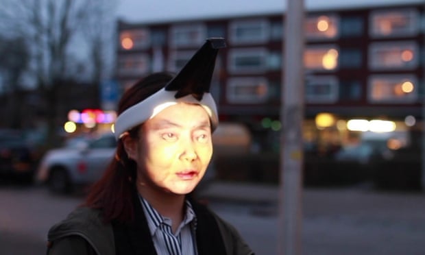 Design student Jing-cai Liu has created a wearable face projector to counter surveillance cameras. Photograph: Jing-cai Liu