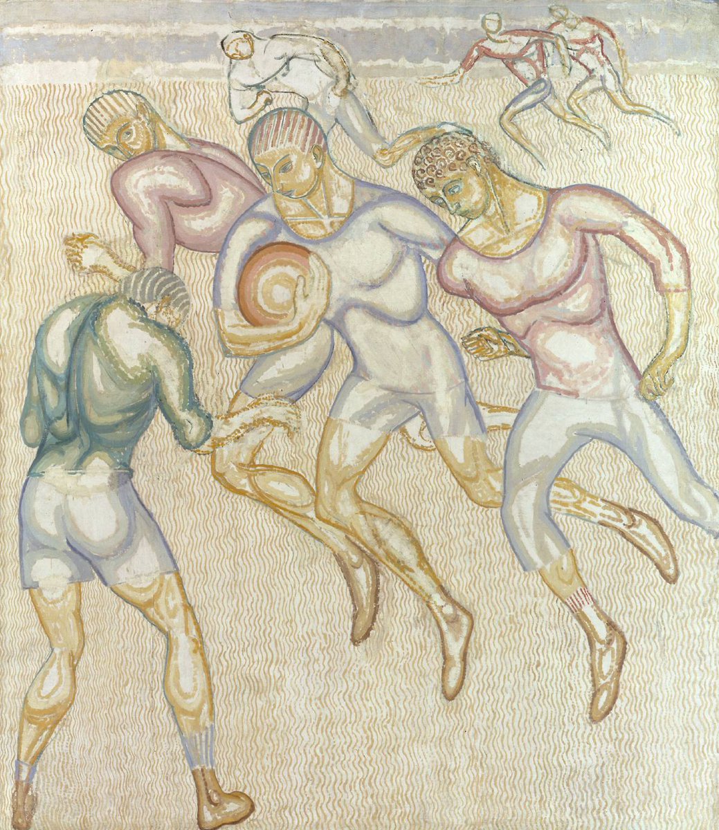 muscular men playing football on the beach