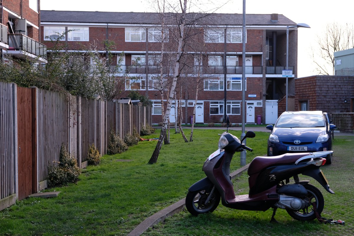 15) The public realm design is a mixed bag. Judging by early designs on Barber's website, it was not anticipated to have such a large car park out front (thankfully not asphalt). There are a few nice touches: small plants along the fence edge, planters, birch trees...