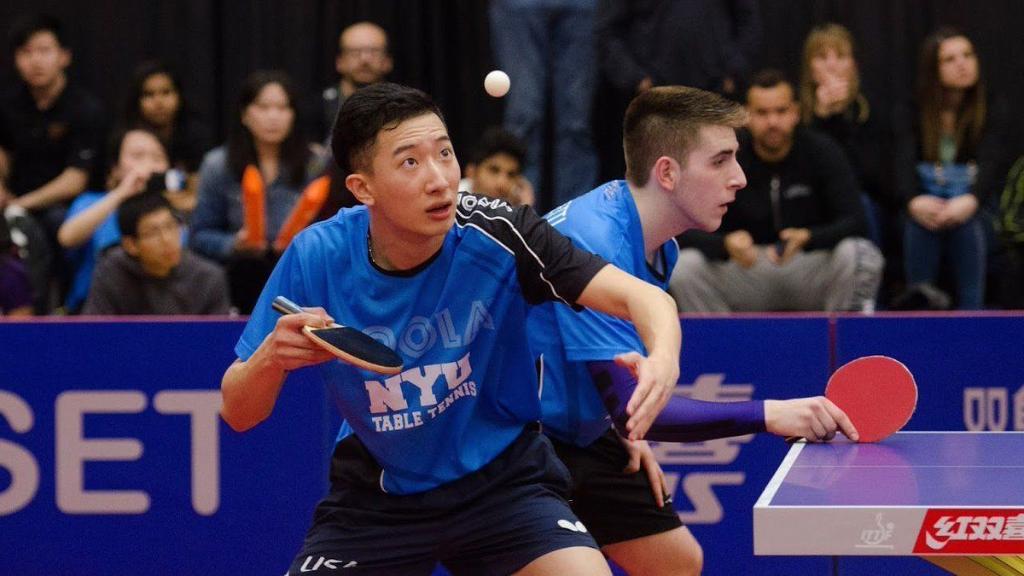 NYU table tennis player about to hit the ball. 