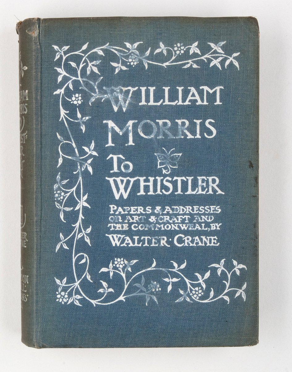 Front cover of a book titled 'William Morris to Whistler: Papers & addresses on Art & Craft and the Commonweal, by Walter Crane'. The cover is blue with white Arts and Crafts style typography, surrounded by a stylised floral border.