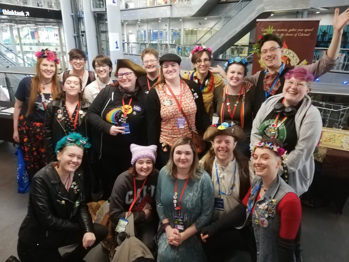 A large group of stowaways (fans of flintlocks and fireballs) having a photo with the cast after the live show