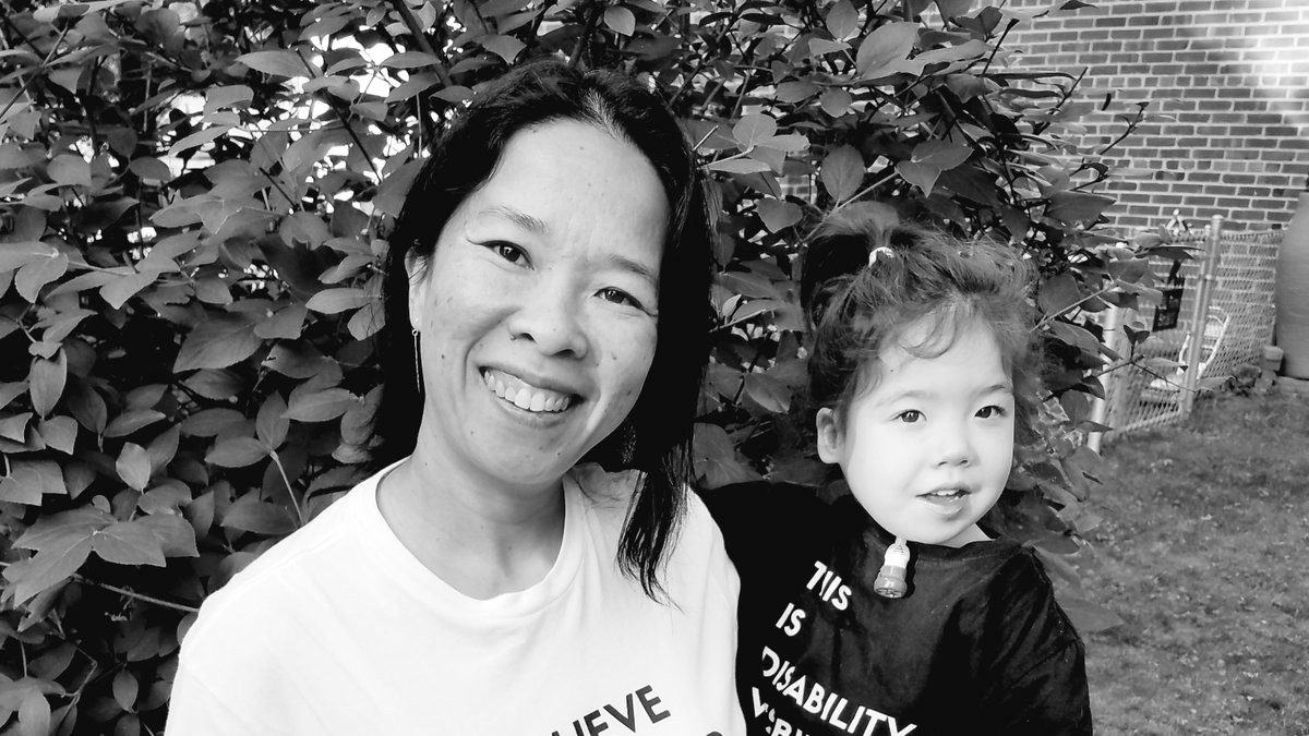 black and white photo of Xiomara and I, both smiling at the camera