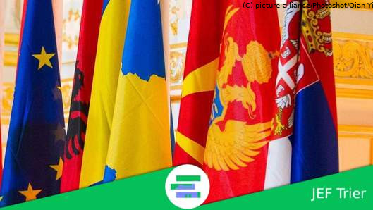 Flags of multiple west balkan countries next to the EU flag