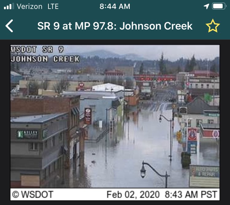 Photos shows SR 9/Cheery Street through Sumas covered in water.