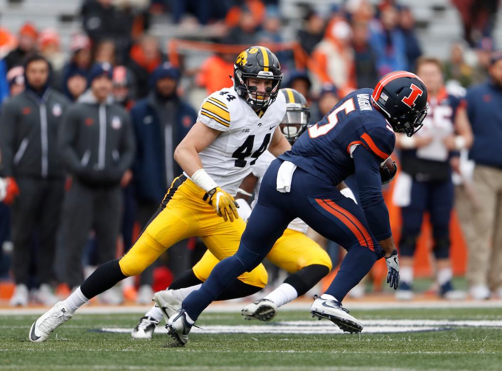 Iowa football's Ben Niemann pursues an opponent, looking to make a tackle during a game.