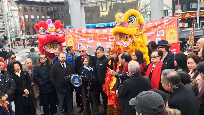 Photo of Dr Barbot and elected officials at a press conference in Chinatown with Lunar New Year decorations.