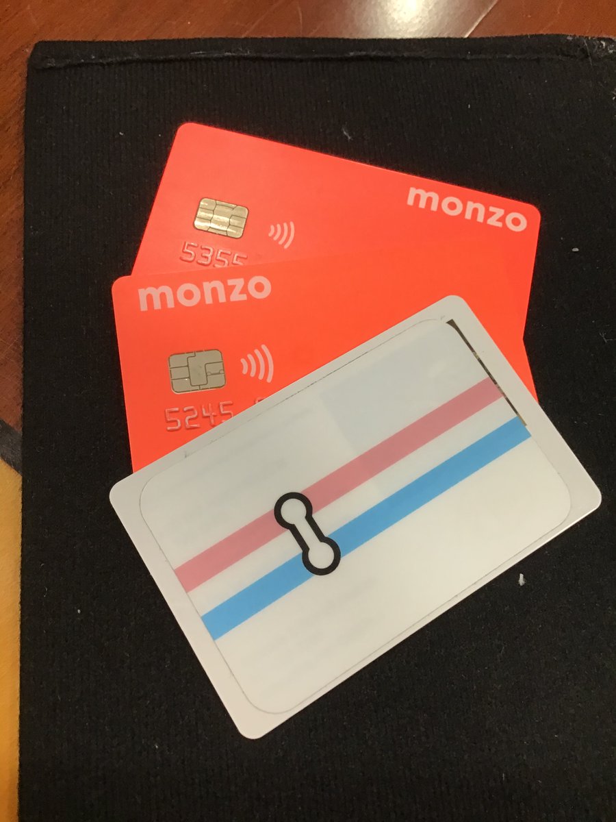 two orange cards with the word Monzo on it