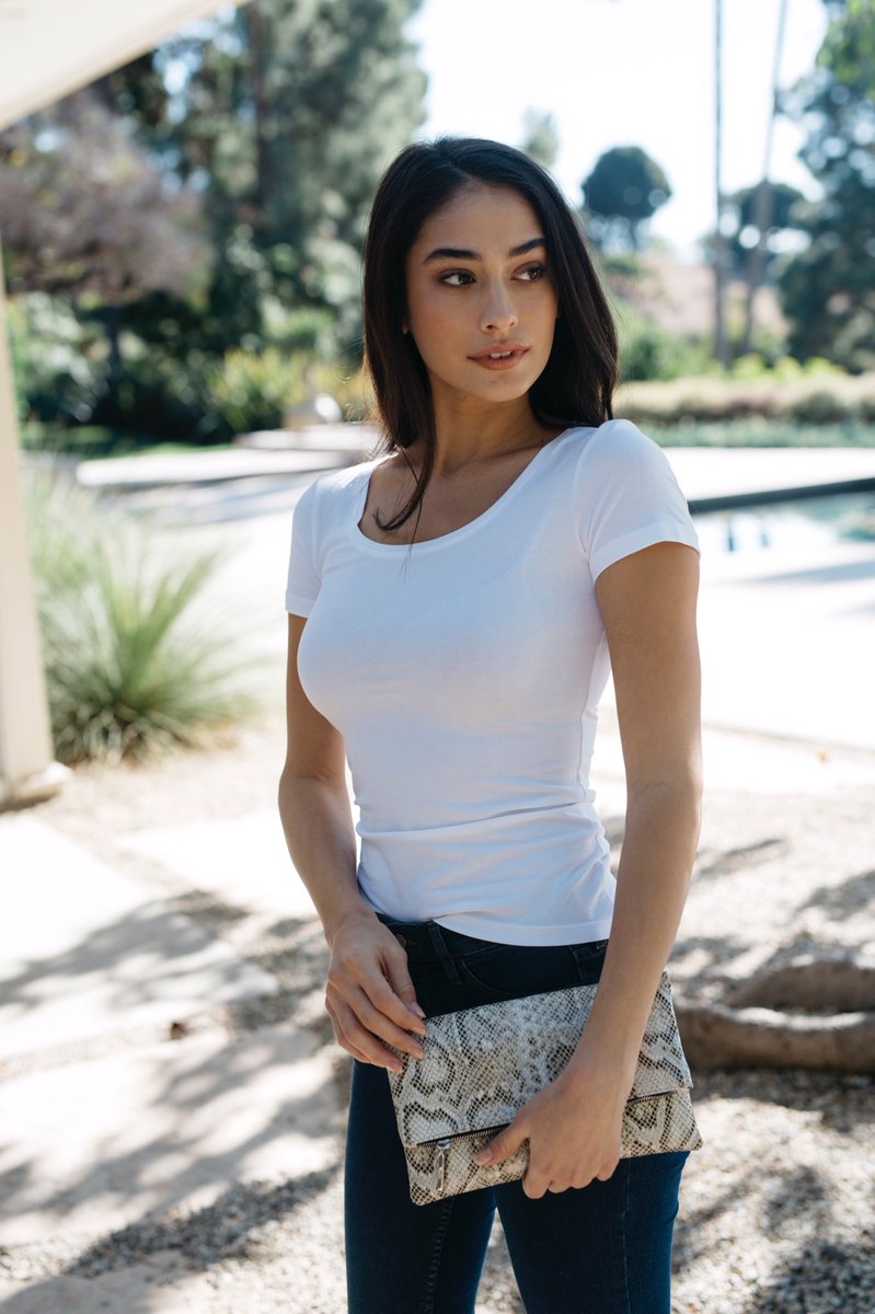 The Eva foldover clutch handcrafted from vegan python leather sourced from Italy. Can be dressed up or down, fits all your essentials and is perfect for travel 🖤