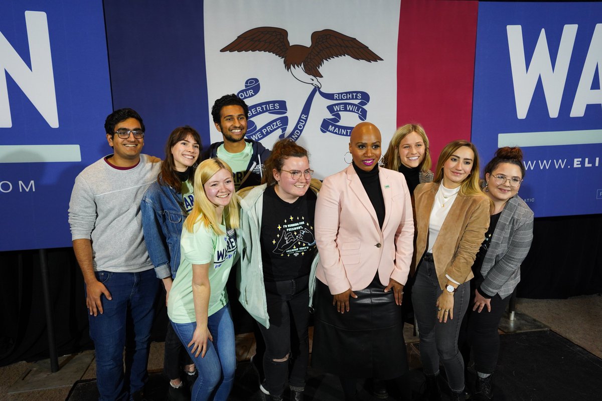 Rep. Ayanna Pressley takes a group picture with Elizabeth Warren supporters.