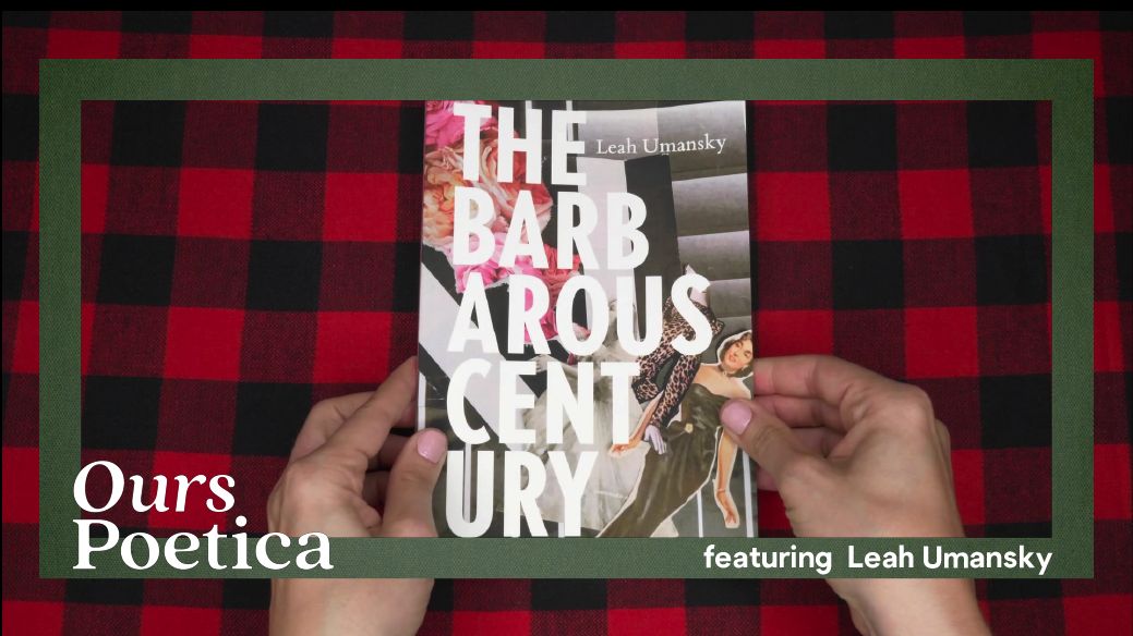 Two white hands with light pink nail polish hold a the book THE BARBAROUS CENTURY from the bottom on a table with a red buffalo plaid cloth.