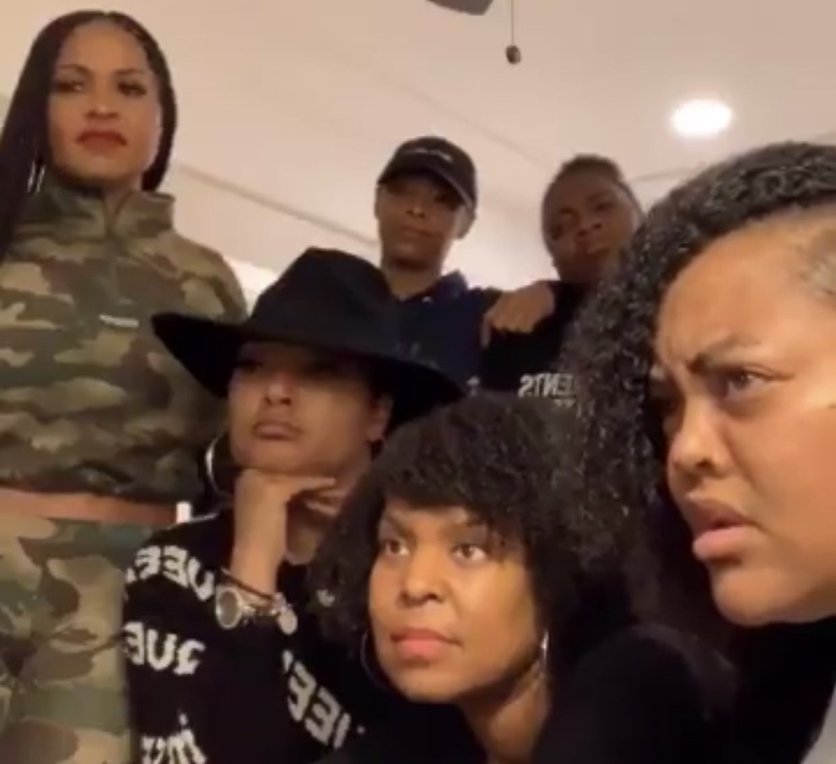 Black Women look perplexed and disgusted at TV screen