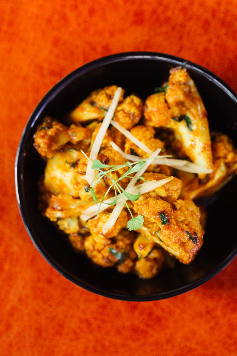 Making vegetables the star of the show 🌟 These beautifully fragrant cauliflower florets are softly spiced and tossed with pepper and thin slices of ginger. #CopperChimneyUK