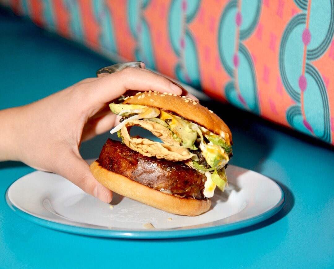 Grab our February #DressYourBurger special by <a href="/AdamKenworthy/">Adam Kenworthy</a> while it's hot 🔥🍔
⠀⠀⠀⠀⠀⠀⠀⠀⠀
It's topped with mushrooms, avocado, peri peri sauce, and papadum, and proceeds go to <a href="/grownyc/">GrowNYC</a>. 

#MadeinaKitchenNotinaLab  #SoLekka