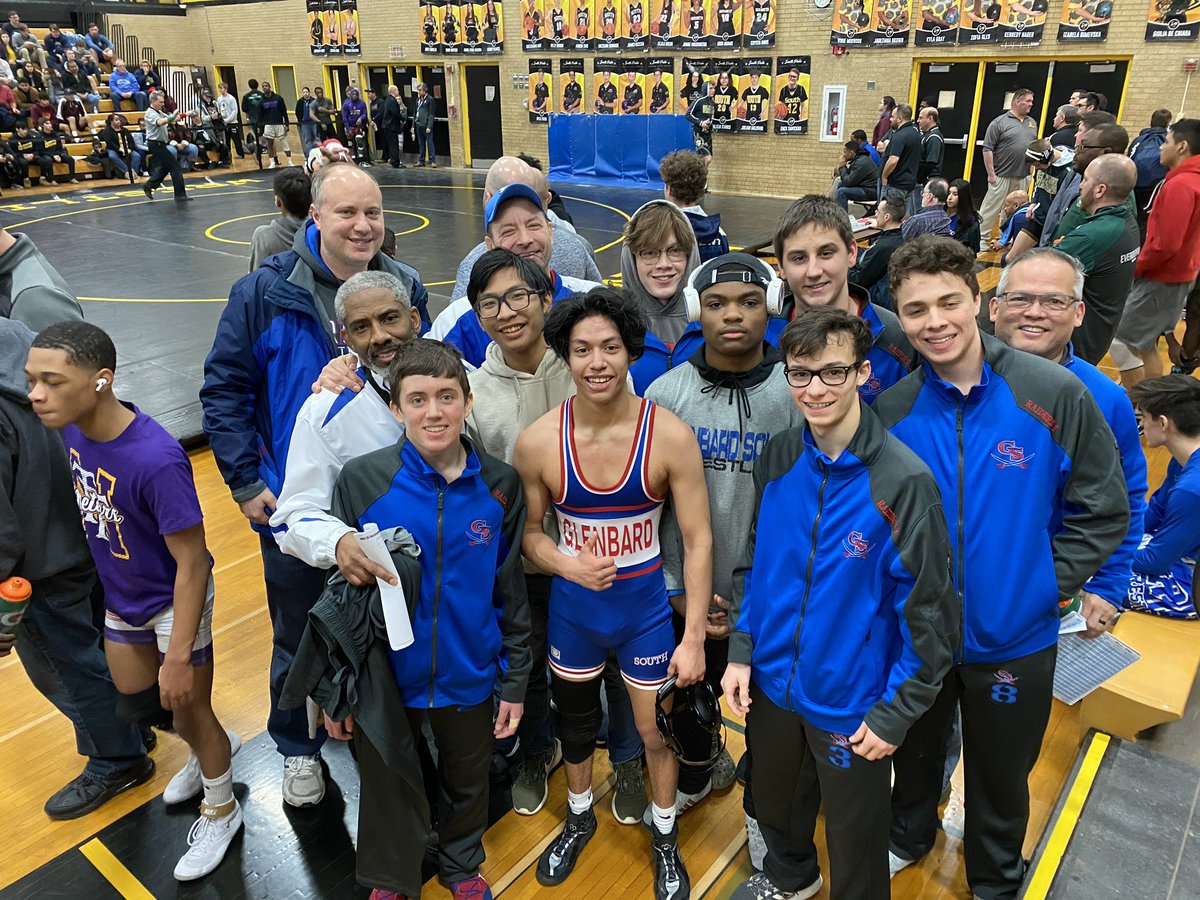 A happy group of Raiders after Hector Andres won his semifinal match and earned a trip to the state finals next week in Champaign.