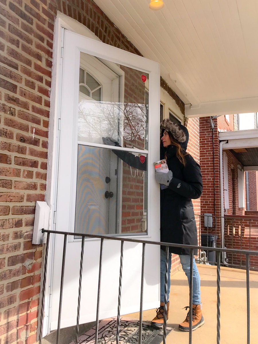 Jess knocking on a voter’s door