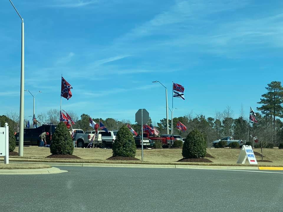A friend who lives in Chatham County, NC took this picture outside of an early voting location today.  

Those flags are not usually there - people drove in with them to do this.  

#NCPol #ElectionTwitter #Primary2020 #chatham #NC