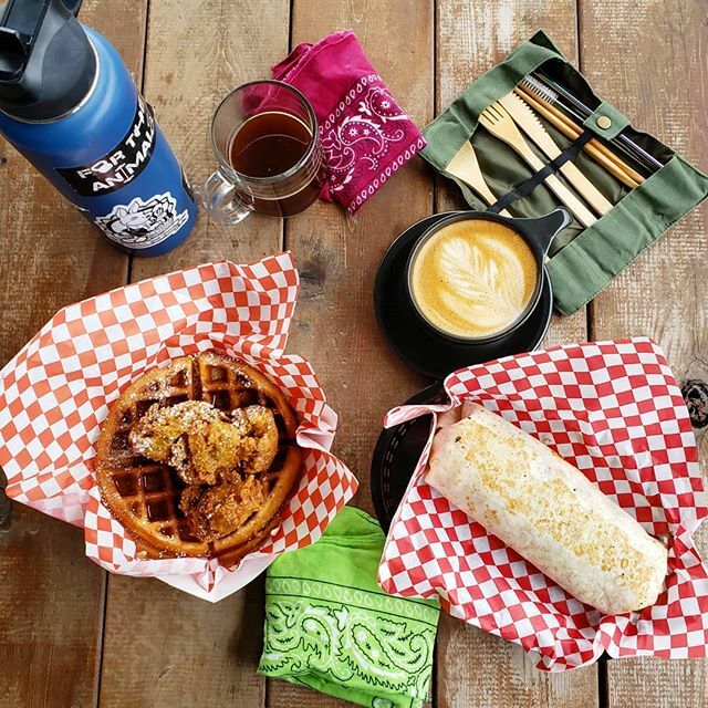 What's up fellow Eco Warriors? Today's brunch at @theoutpostfoodpark inspired me to post about ways you can cut back on waste when eating at Austin's plethora of vegan food trucks (pictured here Chicon &amp; Waffles from @sassysvegetariansoulfood and Brunch Burrito from @thevega…