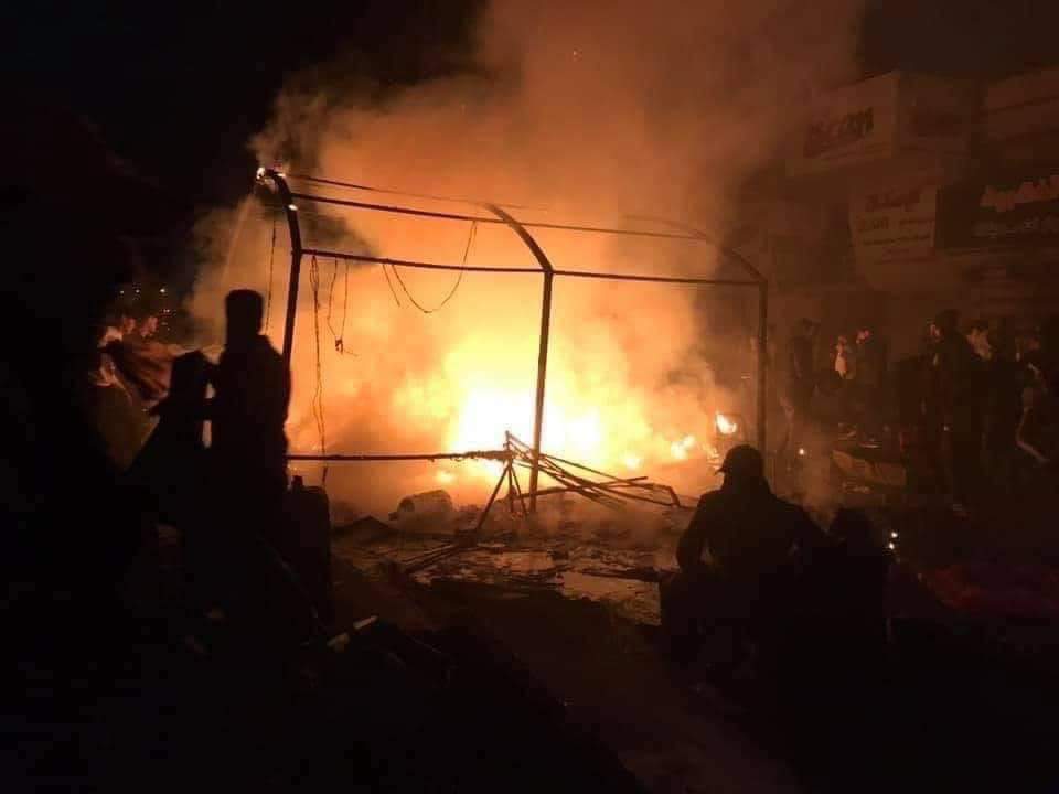 ali_almikdam's tweet photo. These pictures are not from a movie from Hollywood, these are pictures from Tahrir Square, when the Iraqi security forces advanced&amp;burned four tents for the protesters.
The government,Muqtada militias,armed forces, parties&amp;people loyal to Iran are all against the protesters👇🏼👇🏼 https://t.co/gtbsKKX3Uq