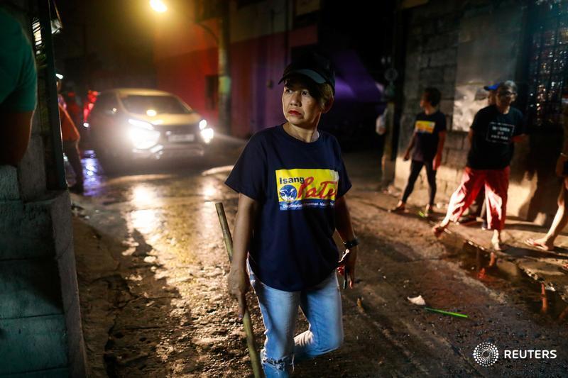 Reuters's tweet photo. Death squad disrupters: Meet the Filipina 'women’s patrol,' a group of mothers and grandmothers whose nightly walks help keep drug killings at bay https://t.co/oIjUSB1Elr by @MartinPetty @eloisaalopez https://t.co/cbn91wqAKM