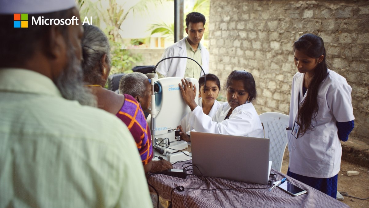 A group of people using eye screening tools.